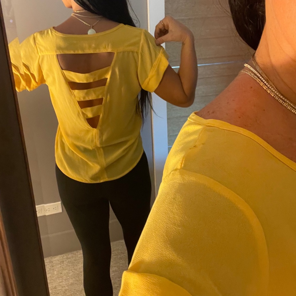 Loose fitting yellow blouse with back detail